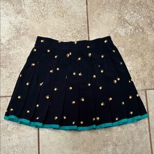 Tail Pleated Tennis Skirt with Yellow Tennis Ball design and Teal Trim